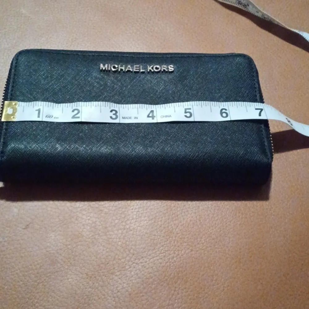 > Michael Kors Black Wristlet with Gold Accents